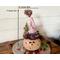 This is a handmade Christmas elf made with a real dried gourd. Including his elf hat, he is 9 inches tall and 4.5 inches wide. 
